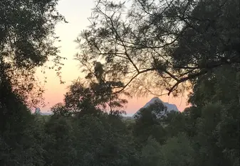 The sunrise over the glasshouse mountains from the base house. 