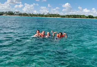 Lacey, Halle, Prutha and I in the warm waters on Bayahibe taking a break from our surveying, using benthos squares, of the coral!!