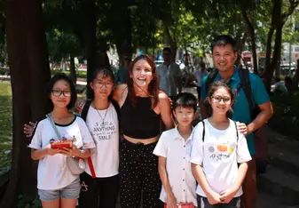 A group of students practicing their English in Hanoi.