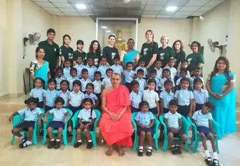 Volunteers with school students