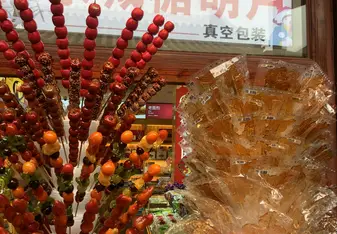 Candied fruit kebabs and sugar twisted into shapes