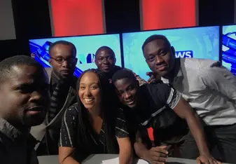 On the television set with a few of the journalists, presenters and crew at Metro TV