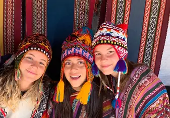 Dressed in fun Peruvian ponchos!
