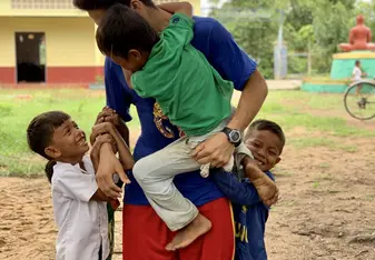 Playing games with children.