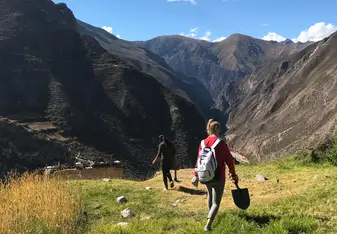 This is an image of my friend as we descend into the Sacred Valley on one of our days of service. All I remember from this moment is how serene the whole scene seemed: the crystal blue sky, the dewy, green grass, and the sublime mountains shooting up from the creeks below.