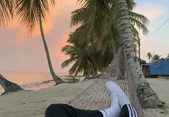 Relaxing on a hammock and watching the sun rise after turtle watching.