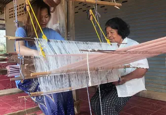 Homestay grandma teaching me how to weave