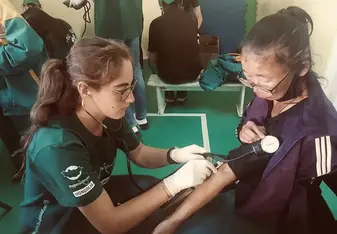 Taking blood pressure on a patient