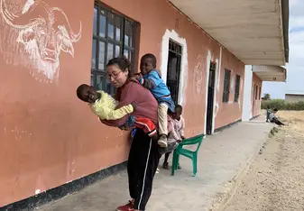 two children hugging me, one in front and the other in the shoulder at the same time. Lovely