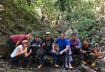 Us with the mahouts and other villagers, helping to build a dam. 