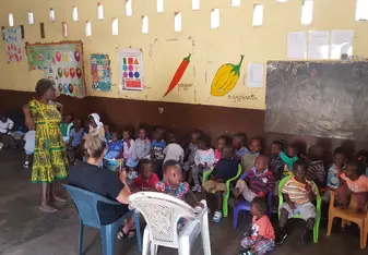 Class English LESSON with teacher and volunteers