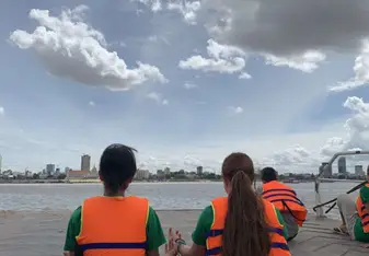 Two of us looking over at the city on the way back from the school