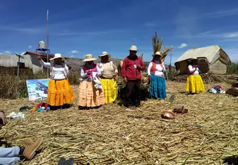 Family on a floating island in Largo Titicaca
