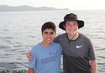 This is a photo of a friend and I on a huge boat that we were on in the ocean