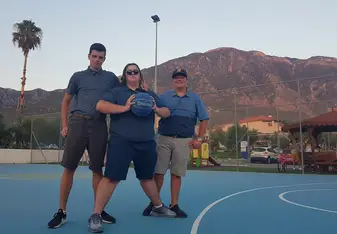 My friends and I playing basketball in Greece with a wonderful backdrop.