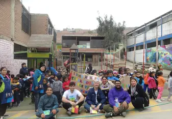 Volunteer team with children from the community