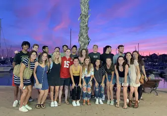 A group photo of the CIEE Alicante students at the pier one night