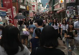 A photo of Harajuku street which was packed with people making it hard to walk through.
