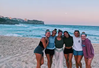 A sunset beach trip with my roommates where we also came prepared with a picnic and blankets.
