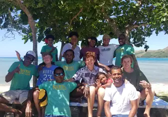 A group picture taken with some of the villagers of Somosomo, Fiji. 