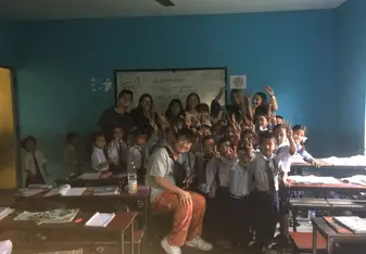 Teaching school children how to brush their teeth 