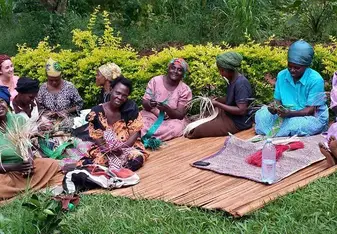 Learning how to weave rugs with the ladies. 