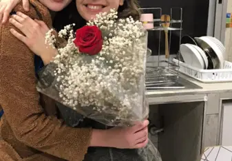 Me and my girlfriend Maria hugging with flowers