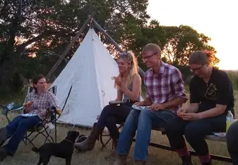 Lovely picture of our group kicking back by the fire at the nearby campsite after a day's ride