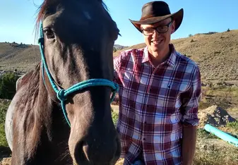 Me and Charcoal ready to get saddled up in the morning