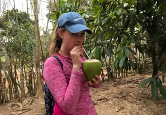 Drinking straight from a coconut