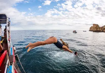 Diving off a boat in Lagos, Portugal.
