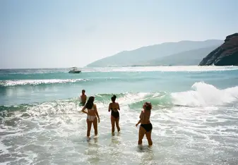 Students on a school trip to the Island of Andros beach 