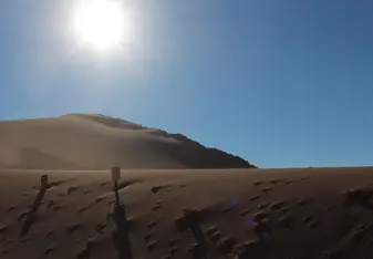Sun setting over a desert landscpae