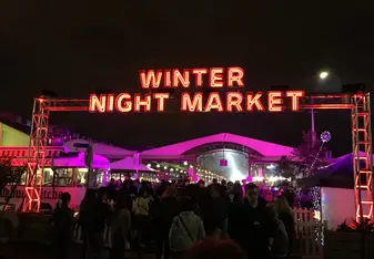 Neon sign saying, "Winter Night Market."