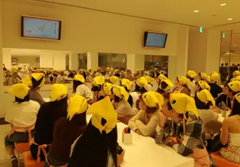 Students watching a video about Chicken Ramen at the Cup Noodle Museum in Yokohama