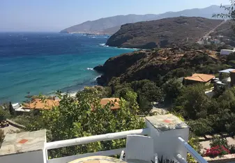 View from the cliffs looking down at a beach on Andros Island.