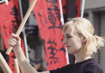 Performing with the Japanese drum club during a local festival