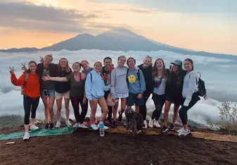 There are so many different things to do, with the other volunteers, like visiting new plces, go on waterfalls, temples, rice terraces, and even climb a volcano like in the picture!