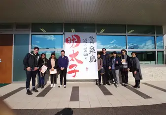Outside the Yamasue production facility with other interns and staff.