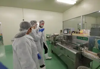 During a tour of the Yamasue production facility learning about the mentaiko extraction process. 