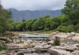 View of a river with mountains in the background.