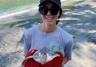 Releasing a turtle at Atuh beach