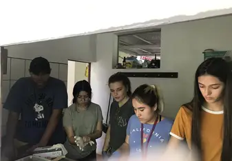 Preparing food to feed the animals 