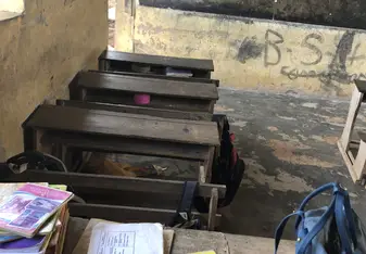 A classroom with the teachers desk in one of the schools on the project.