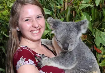 Holding a Koala from the Rainforestation Sanctuary in Cairns