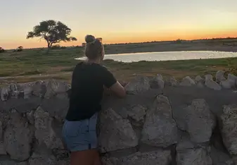 Sunset at a waterhole in Etosha, Namibia
