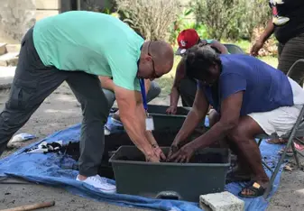 Helping with the earth boxes