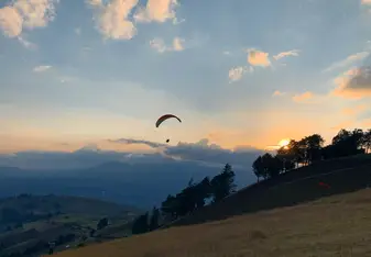 Paragliding with a sunset.