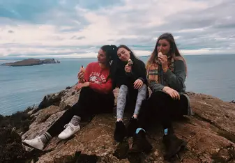 Sitting on a rock with my classmates.