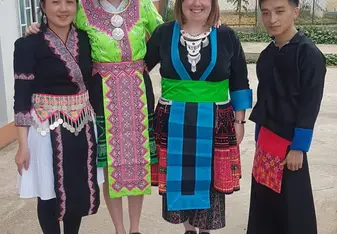 Those costumes are traditional Hmong costumes to celebrate the New Year. Some woman still sew those beautiful clothes by themselves. It takes them about half a year to a year, because there is a lot of complicated embroidery involved. 
